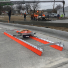 The Chameleon Trac 11 Brush Kit is fed across the concrete via a rope which is pulled by a motor. This applies a brushed finish to concrete across wide bays or areas where poles can not be connected. 